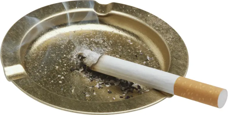 Cigarette in a Golden Ashtray