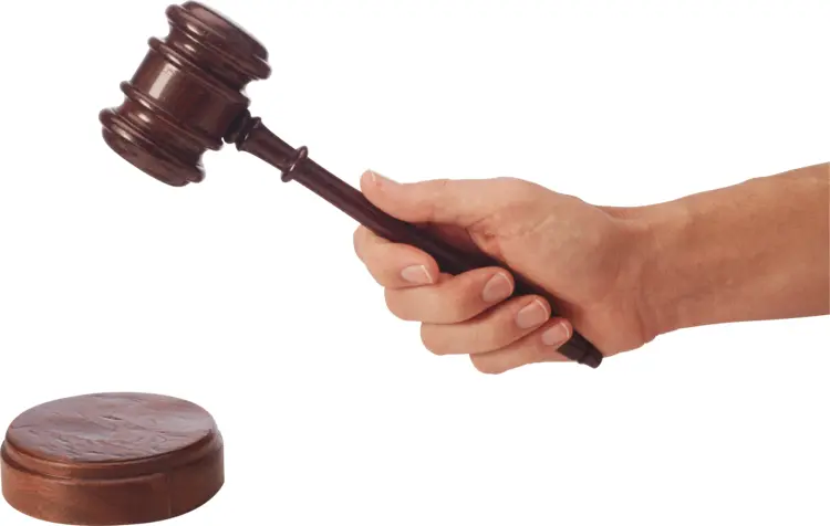 Hand Holding a Gavel