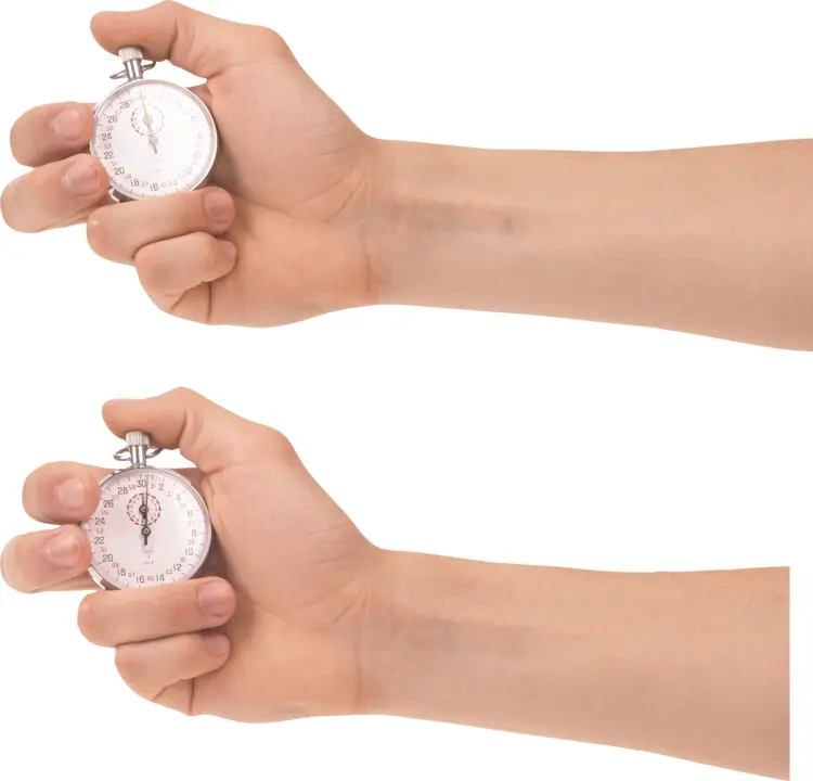 Hand Holding a Stopwatch