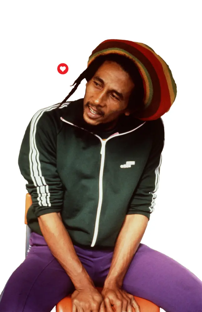 Person in Rasta Hat and Green Jacket