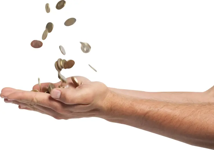Hand Holding Falling Coins