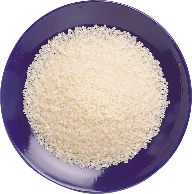 Uncooked Rice in Blue Bowl