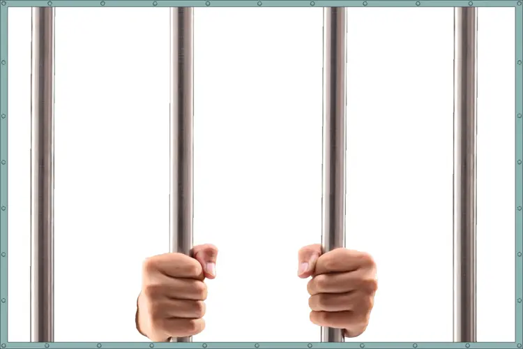 Hands Holding Jail Bars