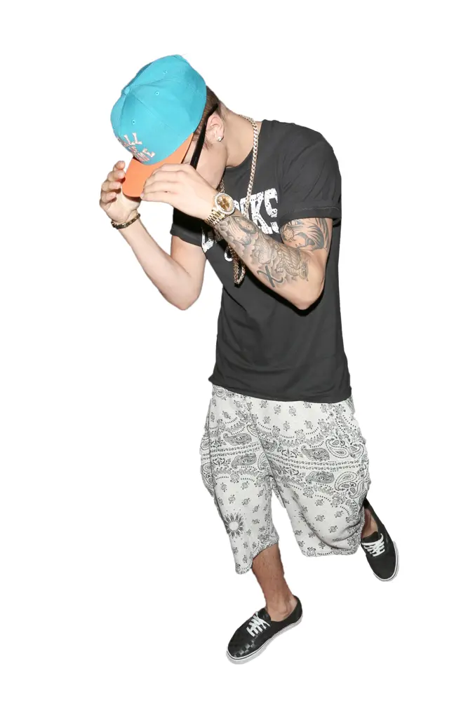 Person in Casual Clothes with Cap and Tattoos