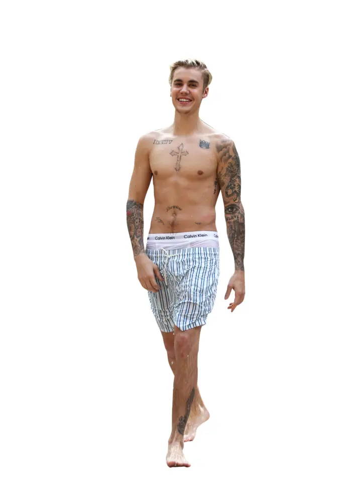 Shirtless Man with Tattoos Smiling