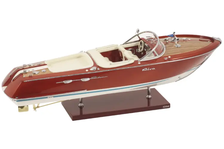 Red and White Boat Model on Stand