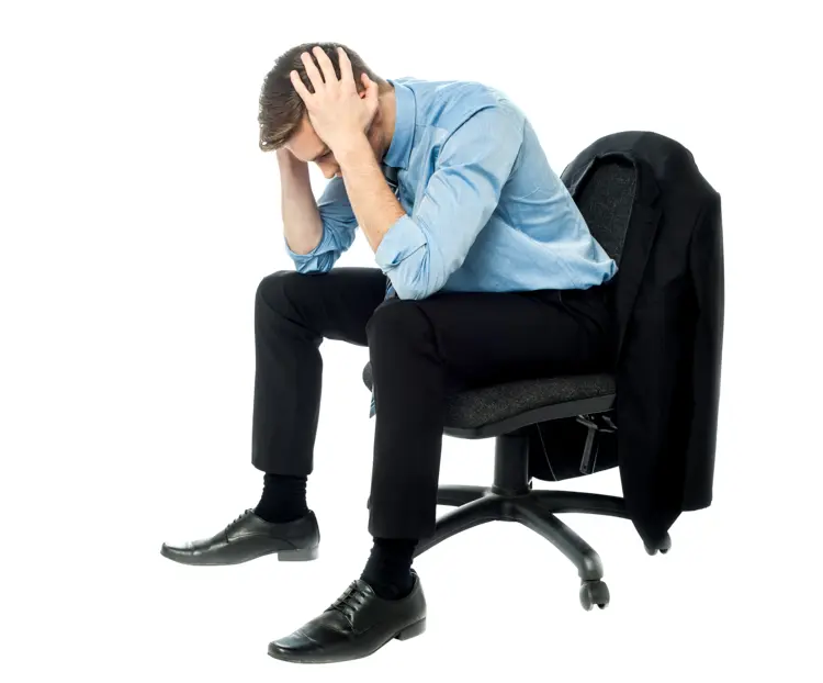 Stressed Man Sitting in Office Chair