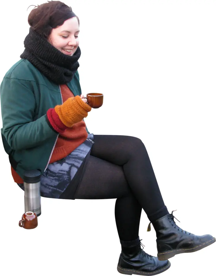 Woman in Winter Clothing Holding a Coffee Cup