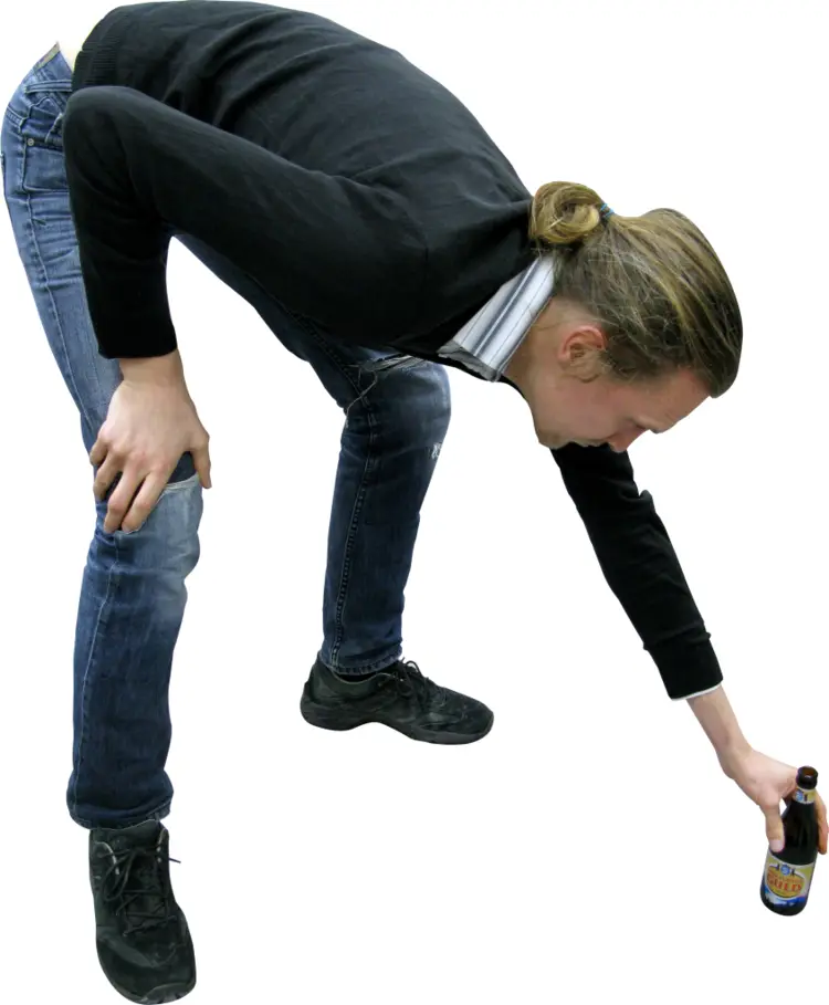 Person Bending to Pick Up Bottle