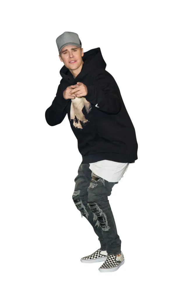 Person in Black Hoodie and Ripped Jeans Posing