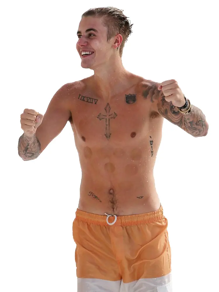 Man in Orange Shorts with Tattoos