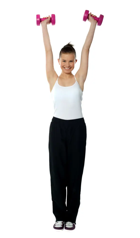 Woman Standing and Exercising with Pink Dumbbells