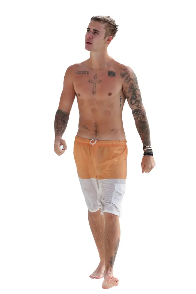 Man in Orange Shorts with Tattoos