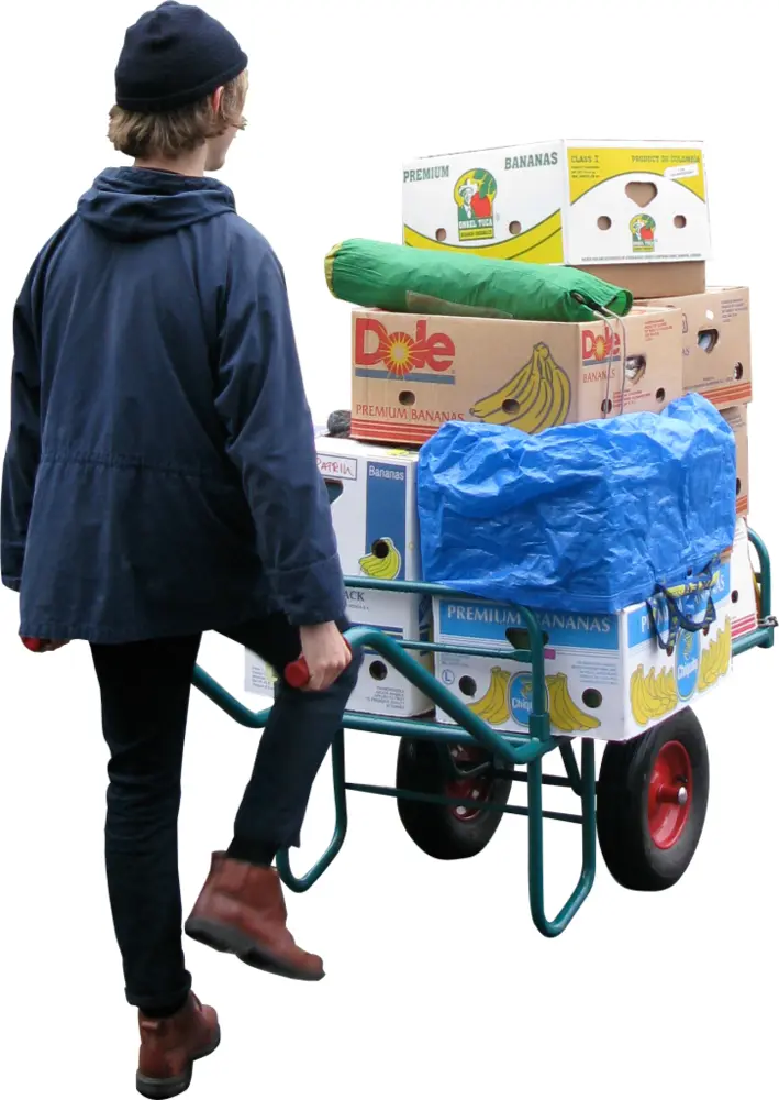 Man Transporting Boxes on Cart