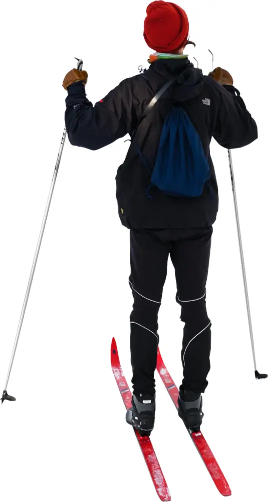 Cross-Country Skier with Red Skis in Winter Landscape