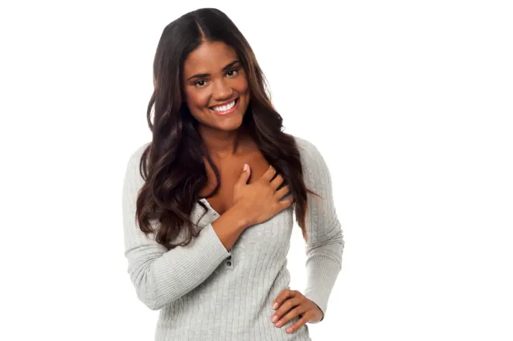 Smiling Woman with Hand on Chest