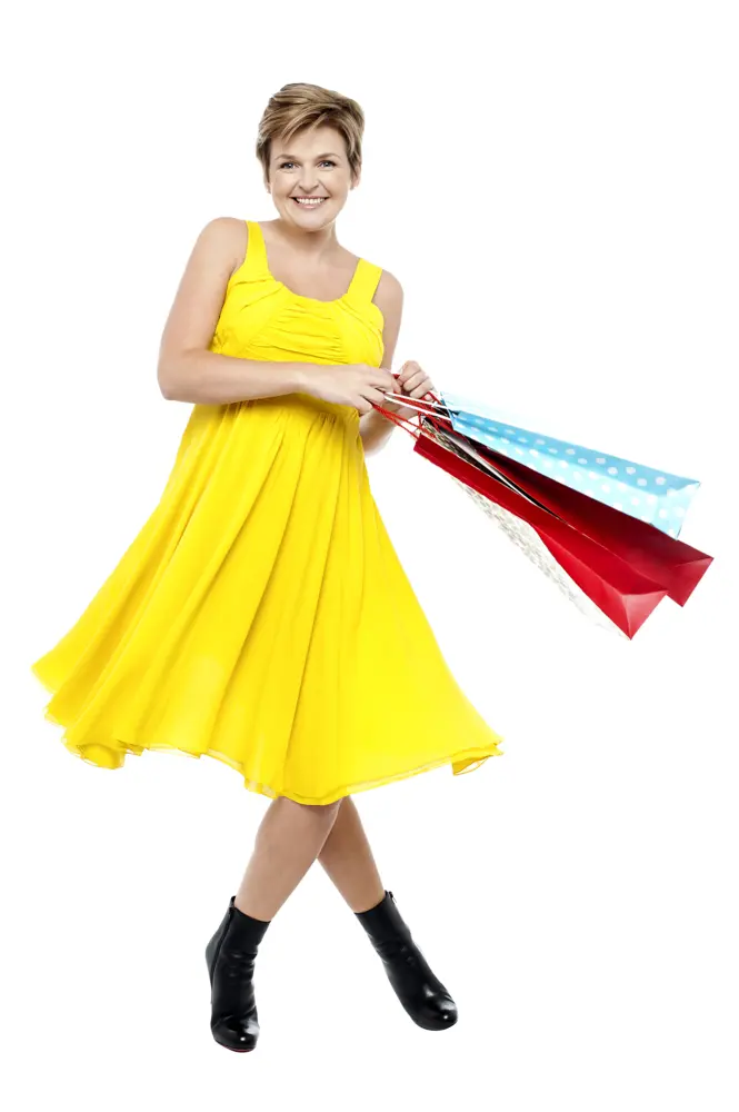 Woman in Yellow Dress with Shopping Bags