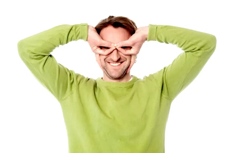 Man in Green Sweater Making Funny Pose