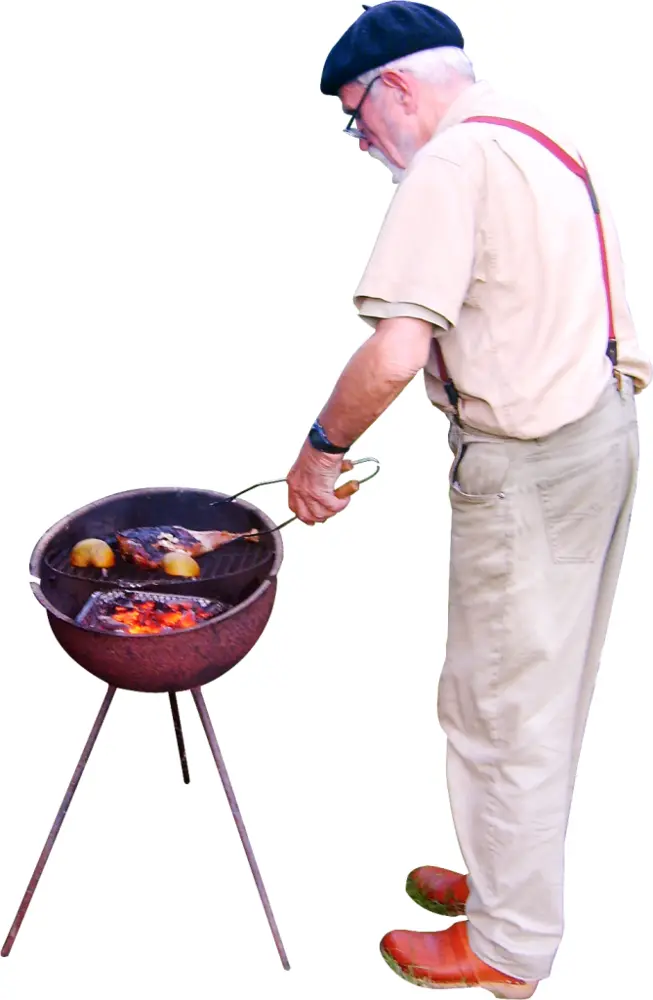 Man Grilling Food Outdoors