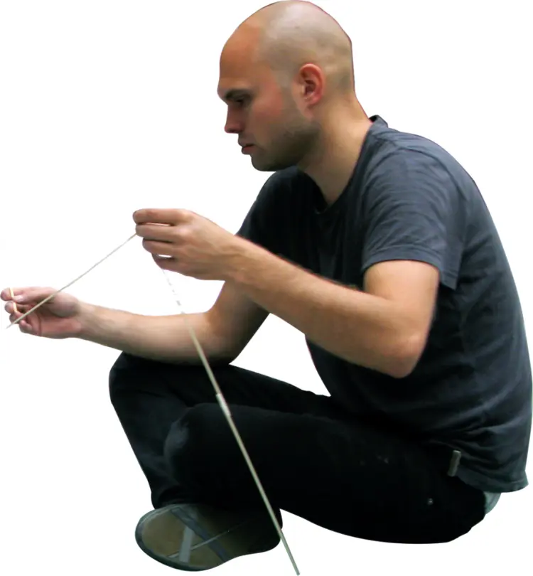 Man Holding Thin White String