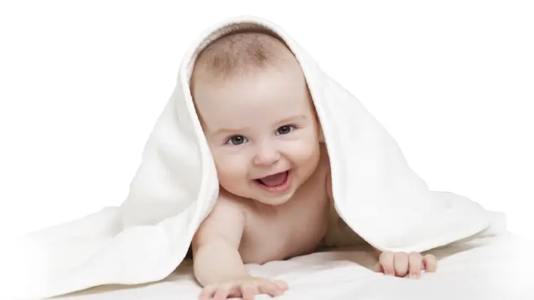 Smiling Baby Under Blanket