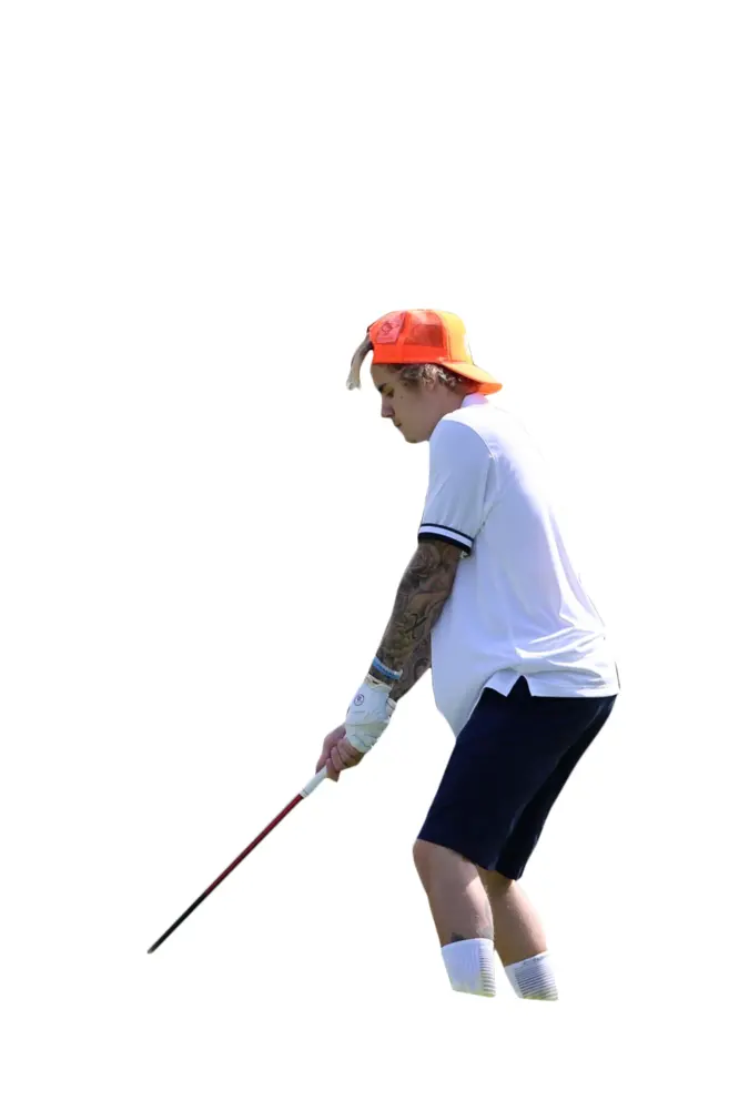 Golf Player in Action with Orange Cap
