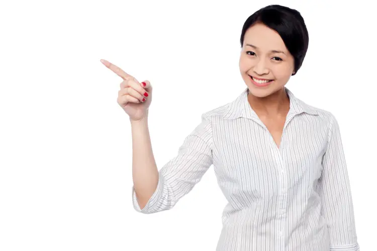 Smiling Woman Pointing in Business Attire