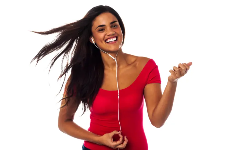Smiling Woman Listening to Music with Earphones