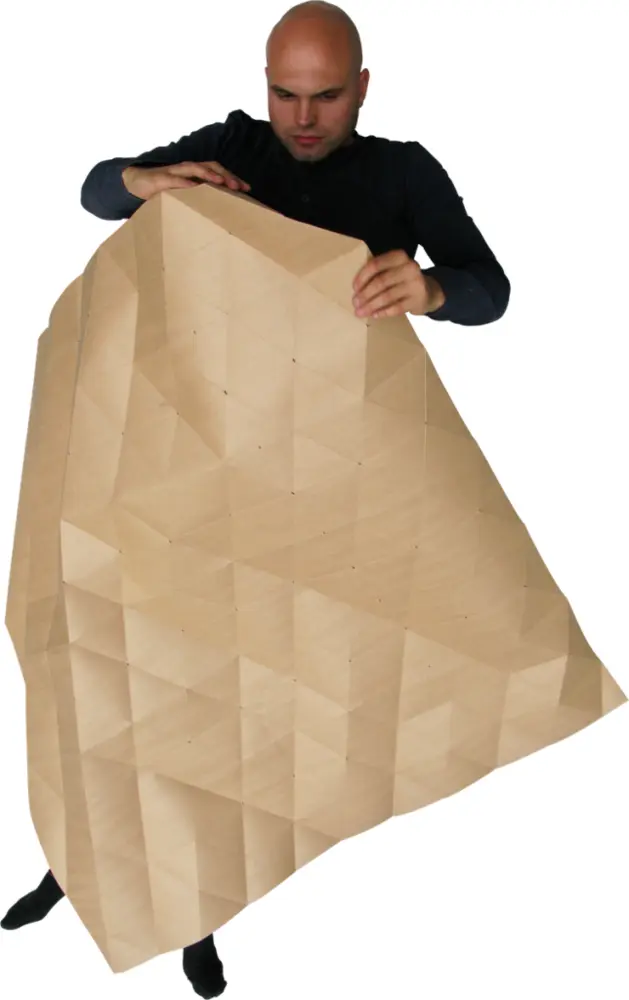 Man Holding Large Folded Brown Paper