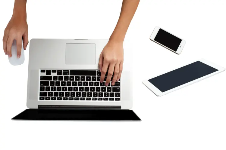 Hands Using a Laptop with Mouse and Smartphone