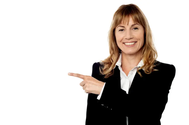 Smiling Woman Pointing in Business Attire