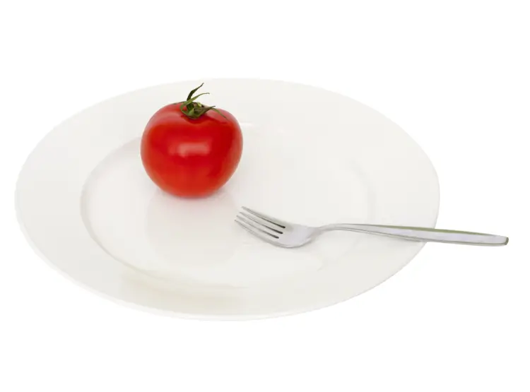 Single Tomato on White Plate with Fork