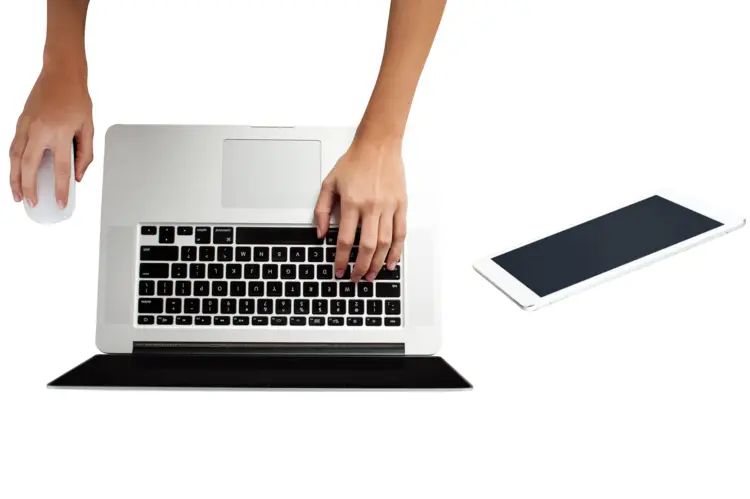 Hands Using a Laptop with Tablet