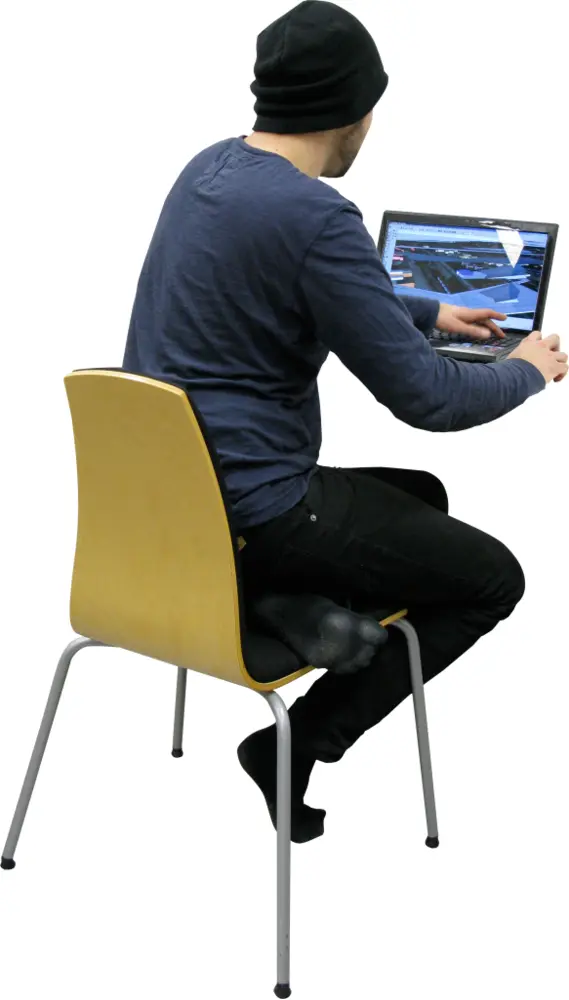 Person Sitting with Laptop