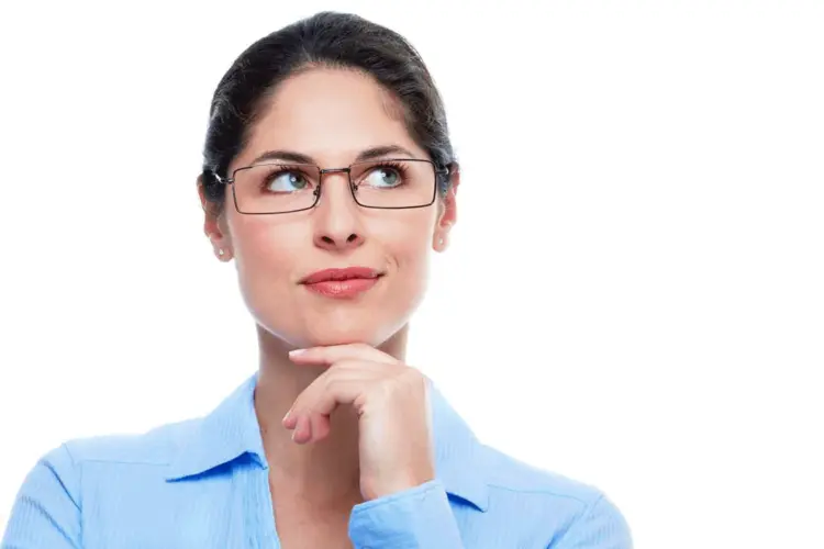 Woman Pondering in Blue Shirt and Glasses