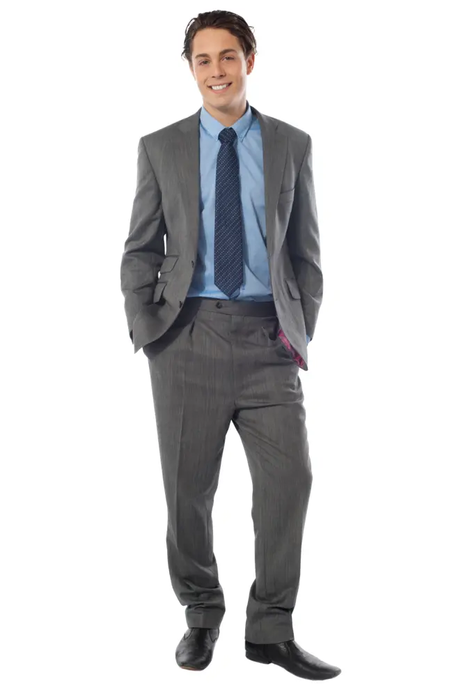 Smiling Man in Business Suit with Hands in Pockets