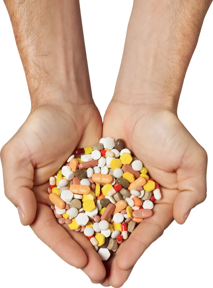 Hands Holding Various Pills