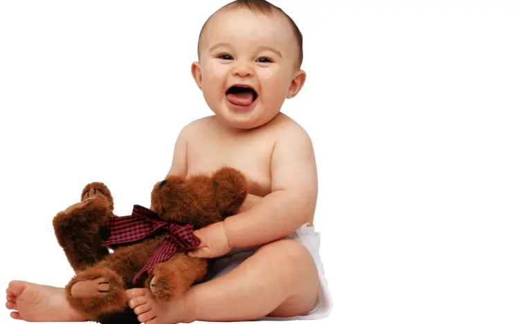 Smiling Baby with Teddy Bear