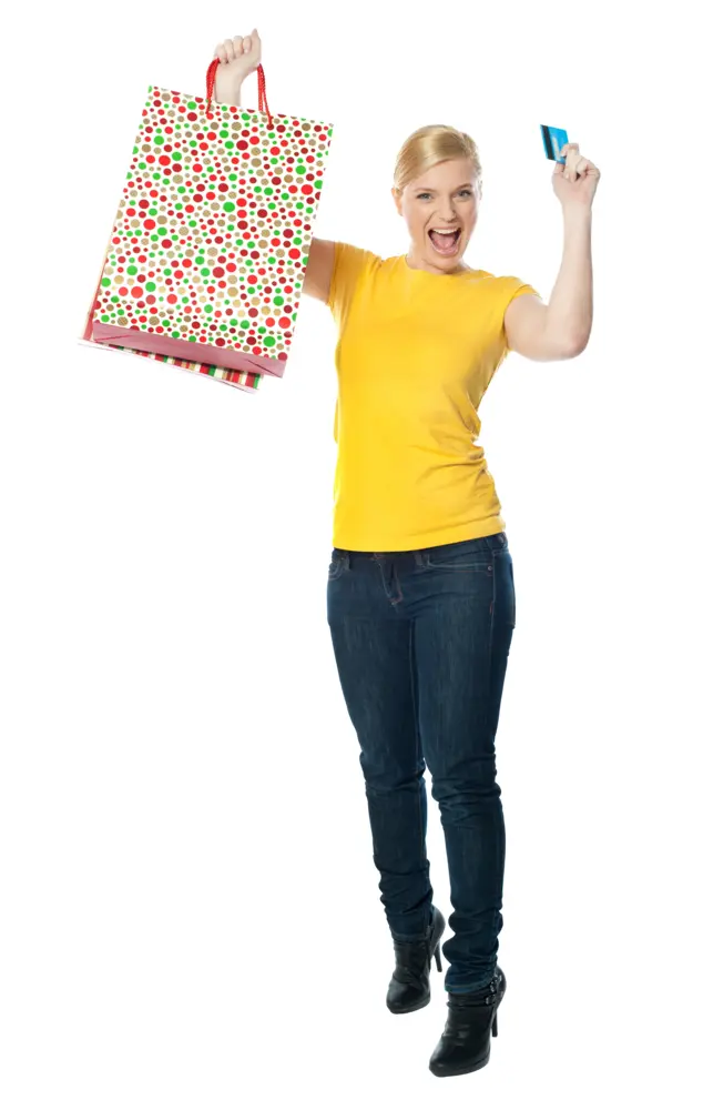 Woman Holding a Colorful Shopping Bag and Credit Card
