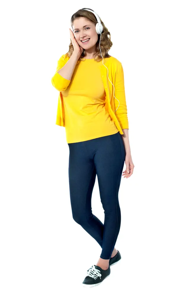 Smiling Woman in Yellow Outfit with Headphones