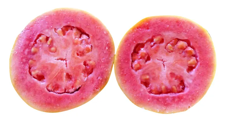Two Halves of a Fresh Guava Showing Pink Flesh