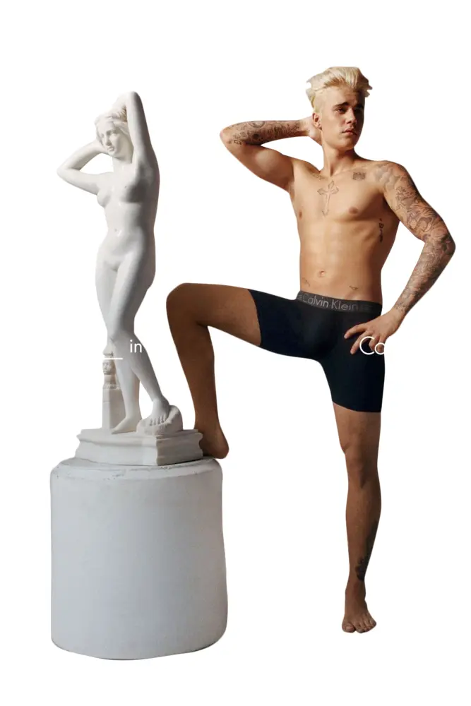 Shirtless Person with Statue and Black Shorts