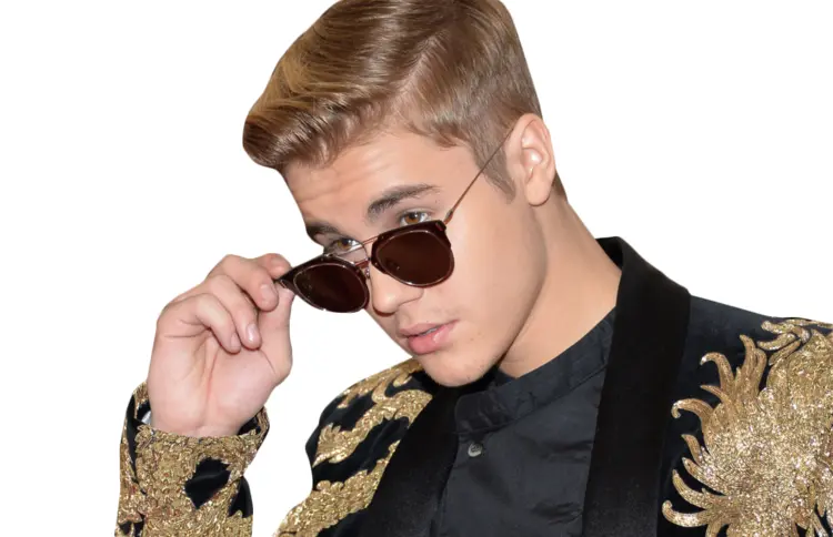 Person in Sunglasses and Ornate Jacket