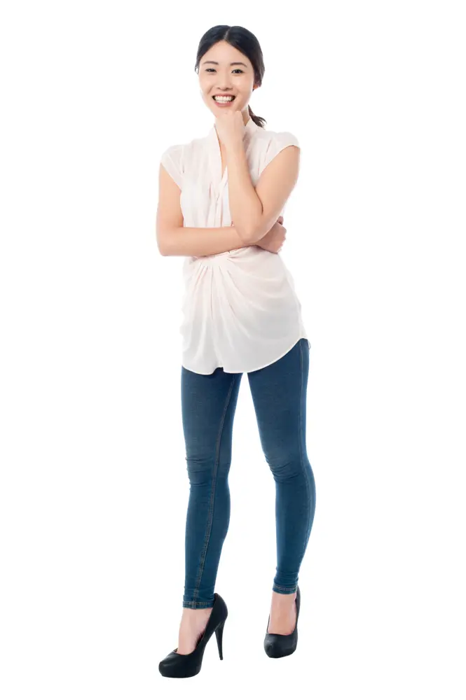 Smiling Woman Standing in Casual Outfit