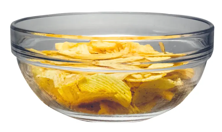 Crispy Potato Chips in a Glass Bowl