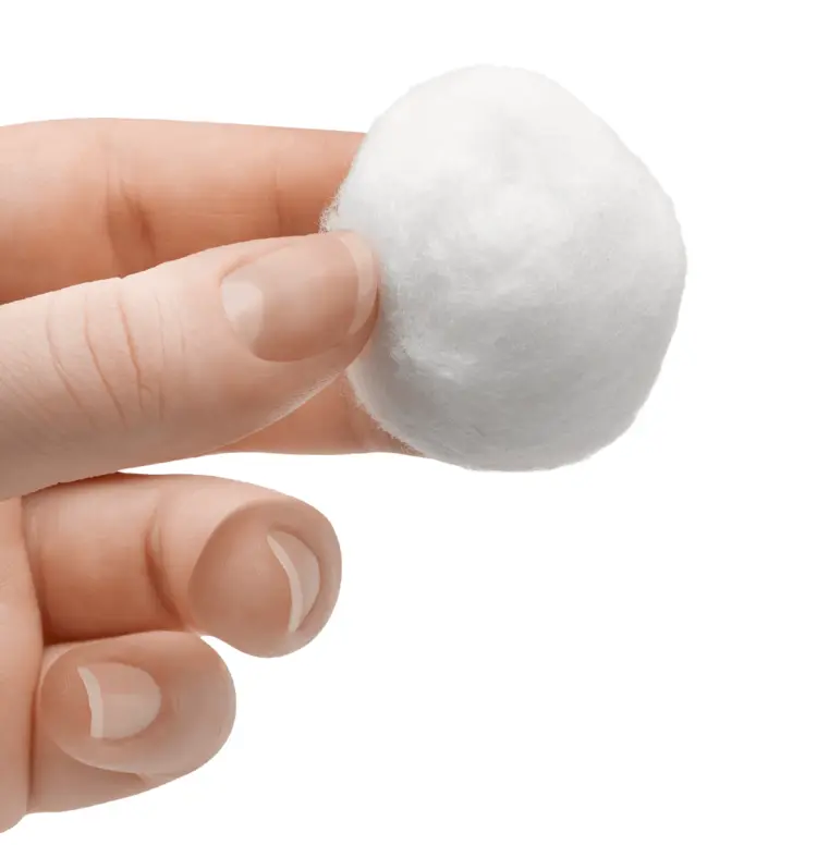 Hand Holding a White Cotton Ball