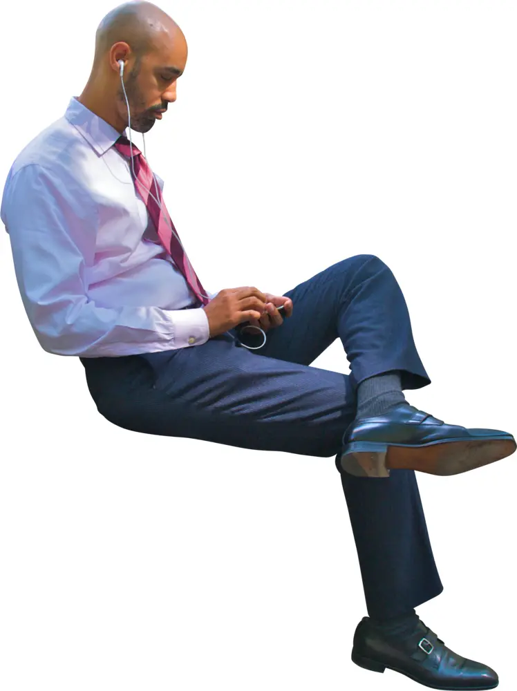 Businessman Sitting with Earphones and Phone