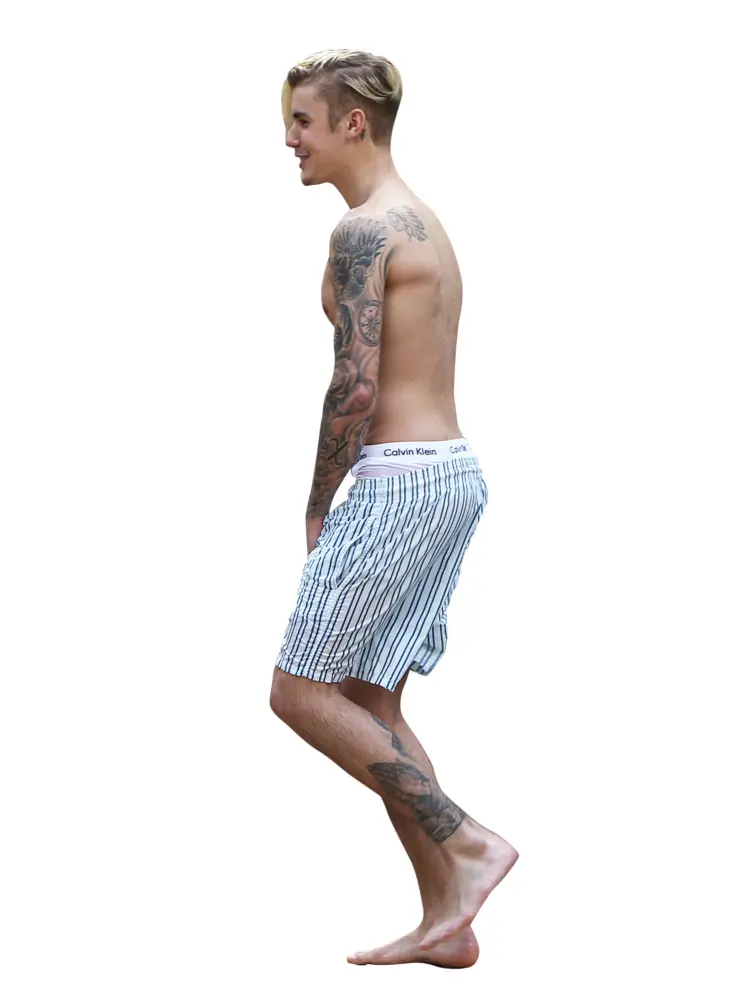 Shirtless Man with Tattoos Walking