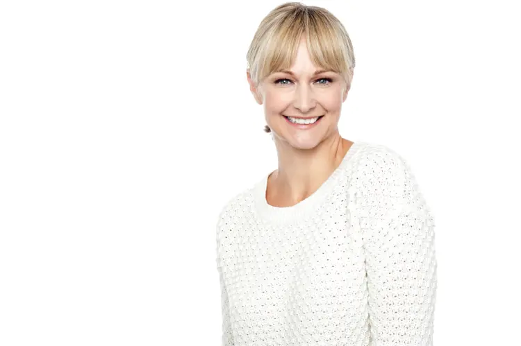 Smiling Woman in White Sweater