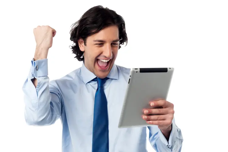 Happy Businessman Celebrating with Tablet